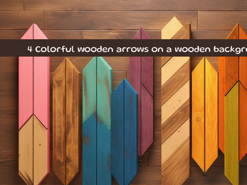 Colorful wooden arrows on a wooden background