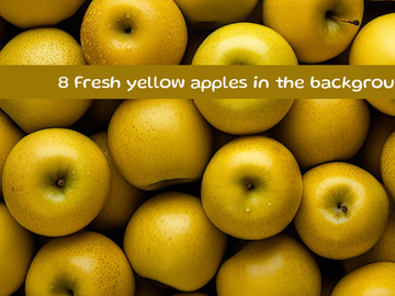 Fresh yellow apples in the background