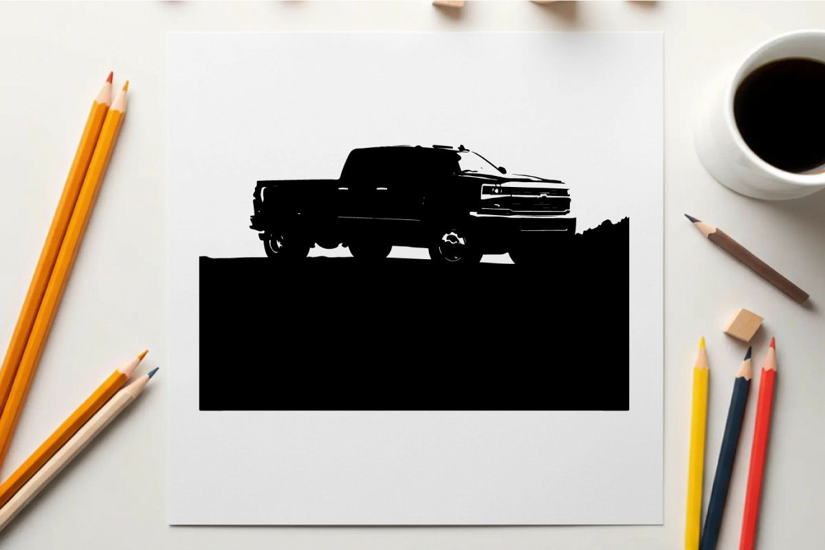 Silhouette eines Pickup-Trucks vor einem Gebirgszug